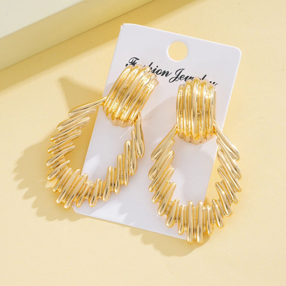 Textured Gold Teardrop Statement Earrings - Image 2